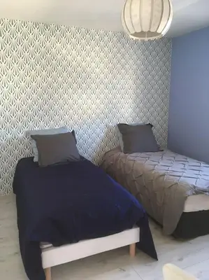 Un ou plusieurs lits dans un hébergement de l'établissement MAISON DE VACANCES 4 Clés - BORD DE MER DENNEVILLE PLAGE