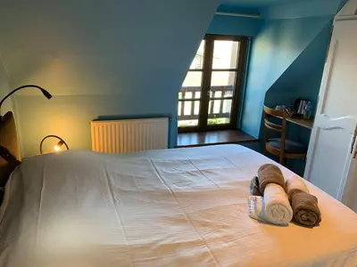 Un ou plusieurs lits dans un hébergement de l'établissement La Bergerie - Gîte et Chambres d'Hôtes