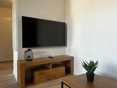 Télévision ou salle de divertissement dans l'établissement Appartement de standing avec parking privé
