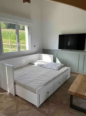 Un ou plusieurs lits dans un hébergement de l'établissement Gite les bois d Orceil