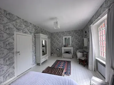 Un ou plusieurs lits dans un hébergement de l'établissement Manoir Charme Baie Mont St Michel