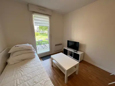 Un ou plusieurs lits dans un hébergement de l'établissement Acajou, Studio avec terrasse et parking privé