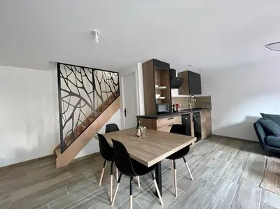 Coin salon dans l'établissement Logis de la Pomme d'Or x Melrose