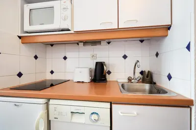Cuisine ou kitchenette dans l'établissement Résidence Port Guillaume - maeva Home - Studio 2 personnes Sélection MAE-3802