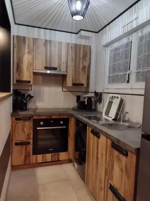 Cuisine ou kitchenette dans l'établissement Eco-Logis le 50, maison avec jardins et terrasse privatifs