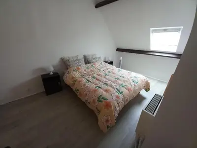 Un ou plusieurs lits dans un hébergement de l'établissement confortable appartement duplex