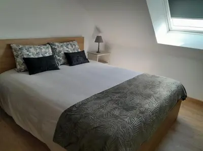 Un ou plusieurs lits dans un hébergement de l'établissement Gîte tante Jeanne
