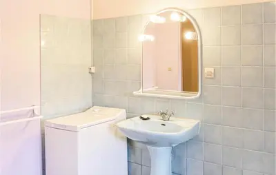 Salle de bains dans l'établissement Le Colibri