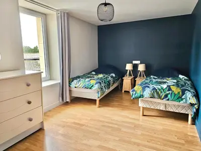 Un ou plusieurs lits dans un hébergement de l'établissement les chambres d'hôtes la Guiberdière