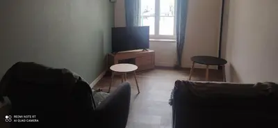 Télévision ou salle de divertissement dans l'établissement gite de La place de l'église