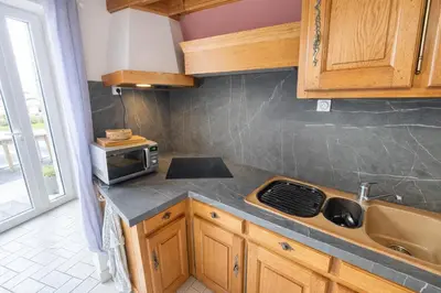 Cuisine ou kitchenette dans l'établissement Refuge familial près de la mer - Jardin & Parking