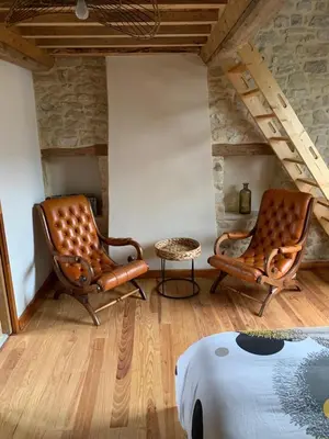 Coin salon dans l'établissement Charmante petite maison