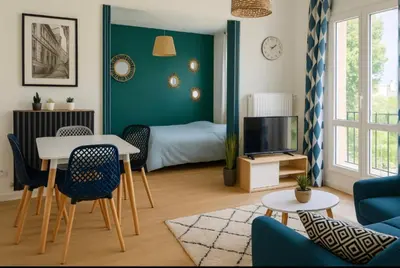 Coin salon dans l'établissement Appartement Spacieux & Parking