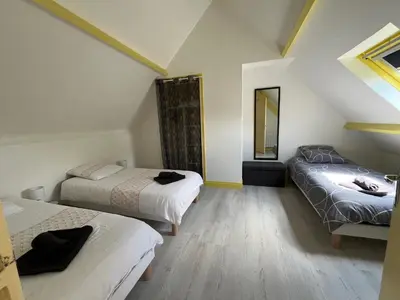 Un ou plusieurs lits dans un hébergement de l'établissement Gîte la Villemain