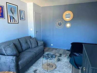 Coin salon dans l'établissement Appartement élégant et chaleureux