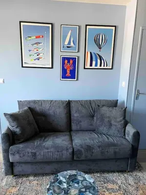 Coin salon dans l'établissement Appartement élégant et chaleureux