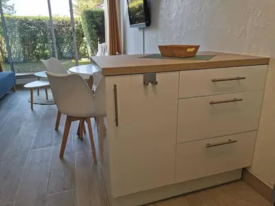 Cuisine ou kitchenette dans l'établissement Appartement accès direct à la plage