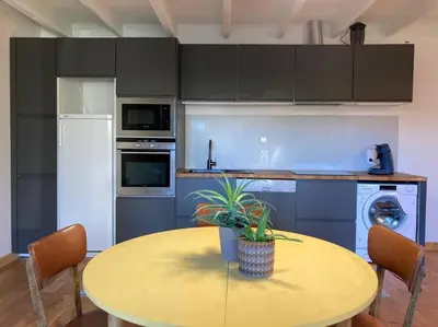 Cuisine ou kitchenette dans l'établissement La maisonnette de Naomi