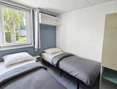 Un ou plusieurs lits dans un hébergement de l'établissement Camping Riva Bella