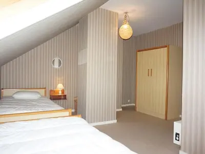 Un ou plusieurs lits dans un hébergement de l'établissement Duplex lumineux 3 chambres, terrasse, parking, à deux pas de la plage de Cabourg - FR-1-465-103