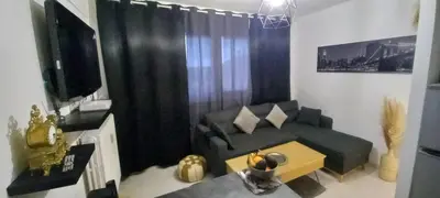 Télévision ou salle de divertissement dans l'établissement LE PHENIX Appartement calme et Cosy