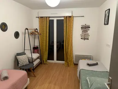 Un ou plusieurs lits dans un hébergement de l'établissement Maison le palmier