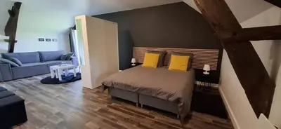 Un ou plusieurs lits dans un hébergement de l'établissement La Petite Taupe - Chambres d'hôtes