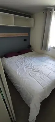 Un ou plusieurs lits dans un hébergement de l'établissement Mobil Home 3 chambres
