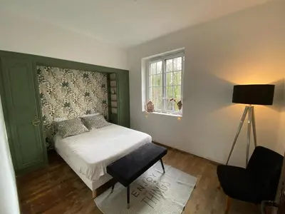 Un ou plusieurs lits dans un hébergement de l'établissement Chambre hôtes