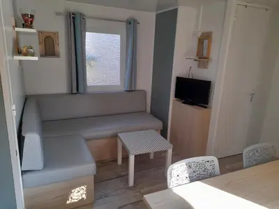 Télévision ou salle de divertissement dans l'établissement RIVA BELLA Lodge 171
