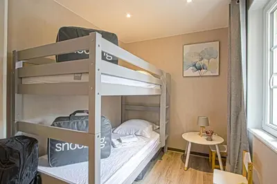 Un ou plusieurs lits dans un hébergement de l'établissement Le nid Saint Jean appartement au coeur de la ville