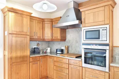 Cuisine ou kitchenette dans l'établissement L'Abri du Repos - Appt vue sur le port