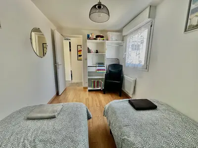 Un ou plusieurs lits dans un hébergement de l'établissement Captain's Quarters - Maison en bord de plage