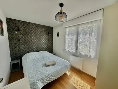 Un ou plusieurs lits dans un hébergement de l'établissement Captain's Quarters - Maison en bord de plage