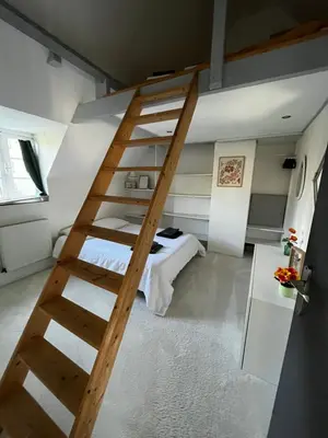 Un ou plusieurs lits dans un hébergement de l'établissement Maison avec cheminée ancienne - Proche Cabourg
