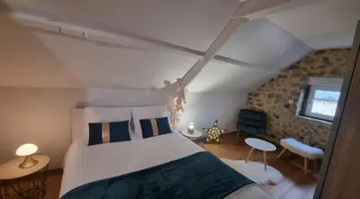 Un ou plusieurs lits dans un hébergement de l'établissement Chambre Colomby Kaabi