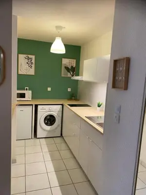 Cuisine ou kitchenette dans l'établissement Appartement Port-En-Bessin Mer Proche
