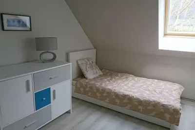 Un ou plusieurs lits dans un hébergement de l'établissement Gîte Les Pommiers