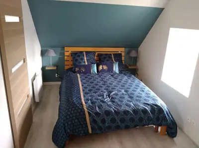 Un ou plusieurs lits dans un hébergement de l'établissement Gîte Les Pommiers
