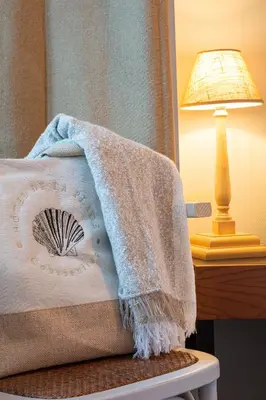 Un ou plusieurs lits dans un hébergement de l'établissement Hôtel De La Plage