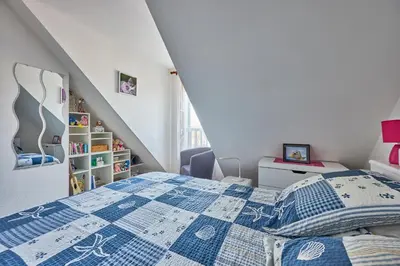 Un ou plusieurs lits dans un hébergement de l'établissement Doudounette - Appartement à proximité de la plage