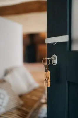 Un ou plusieurs lits dans un hébergement de l'établissement Le Clos d'Omaha - Suites luxueuses à 5 min d'Omaha Beach