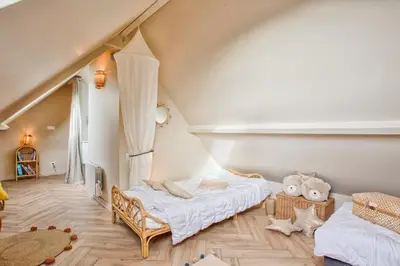 Un ou plusieurs lits dans un hébergement de l'établissement Maison Victoria Cabourg