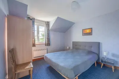 Un ou plusieurs lits dans un hébergement de l'établissement Gîte Les Petites Landes - Piscine privée proche plages