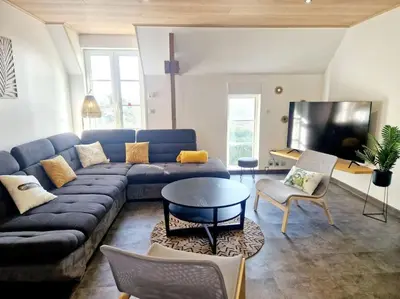Télévision ou salle de divertissement dans l'établissement Le Cap Ouest