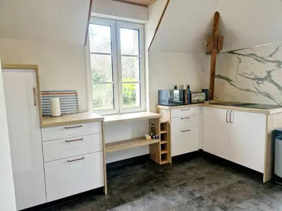 Cuisine ou kitchenette dans l'établissement Le Cap Ouest