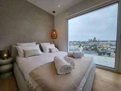 Un ou plusieurs lits dans un hébergement de l'établissement Le Davs - Splendide Appartement avec vue Panoramique - Salle de Sport et Parking Gratuit