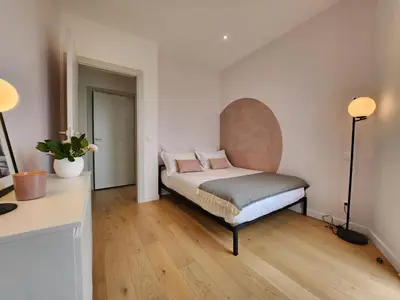 Un ou plusieurs lits dans un hébergement de l'établissement Le Davs - Splendide Appartement avec vue Panoramique - Salle de Sport et Parking Gratuit