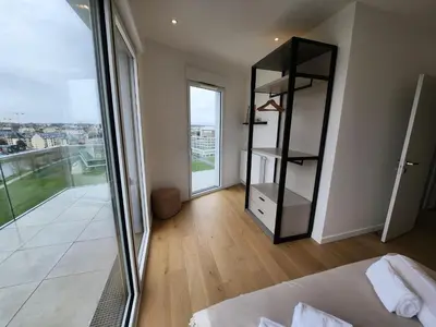 Un ou plusieurs lits dans un hébergement de l'établissement Le Davs - Splendide Appartement avec vue Panoramique - Salle de Sport et Parking Gratuit