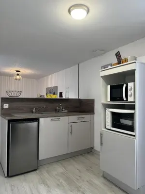 Cuisine ou kitchenette dans l'établissement le Cozy Bayeusain